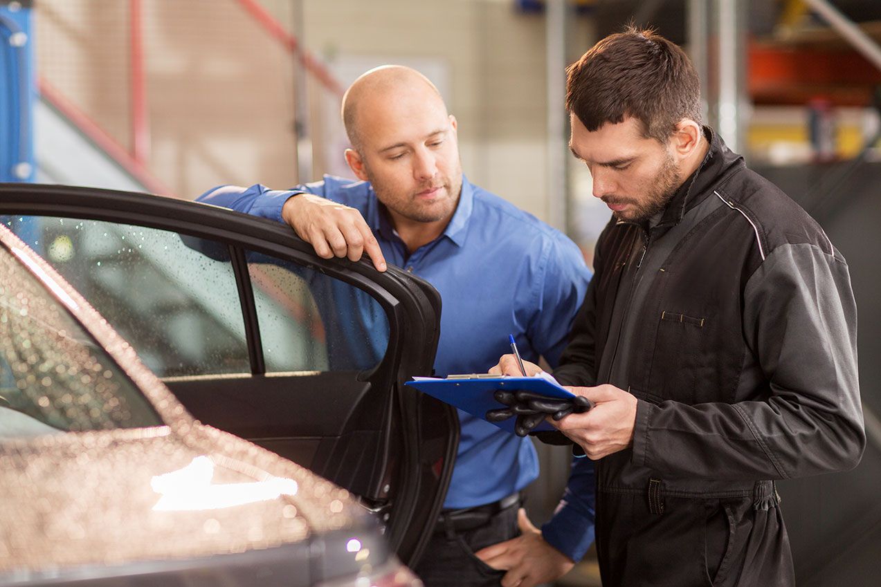 auto-mechanic-and-customer-at-car-shop