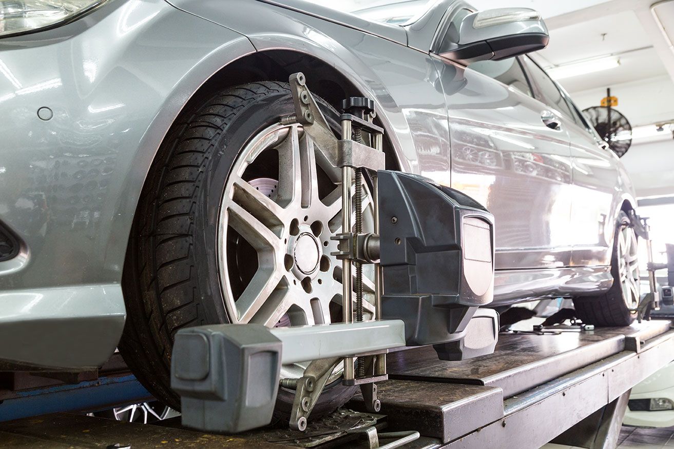 closeup-of-tire-clamped-with-aligner-undergoing-au-2021-09-01-21-14-31-utc